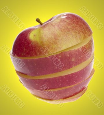 sliced apple on yellow background
