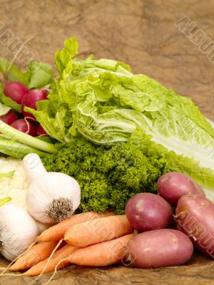 fresh tasty vegetables on brown background