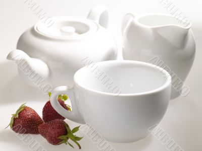 Kitchenware still-life with tea cup, teapot and milk mug