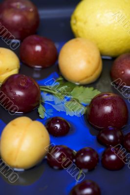 fruit on blue water closeup
