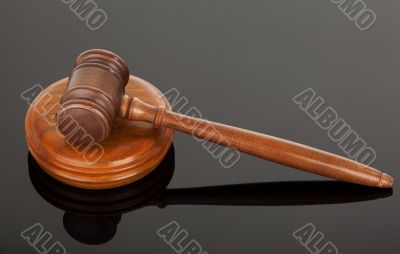 wooden gavel on black