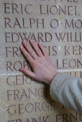 Hand on the memorial wall