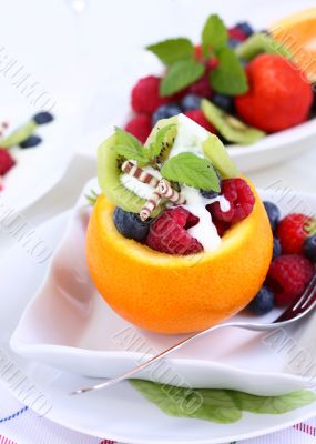 Orange filled with fruits