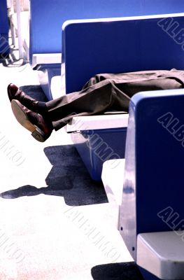 Businessman Lying on Bench