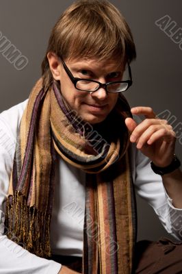smiling man in glasses and scarf