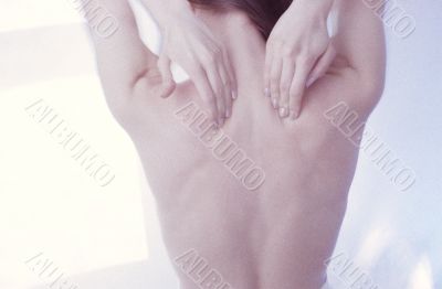 Woman Massaging Her Back