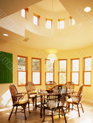 Dining Room Surrounded By Windows