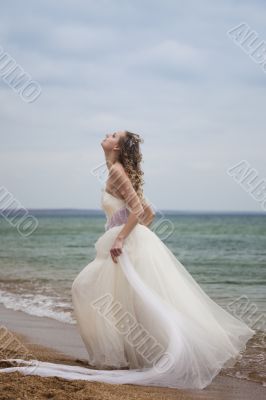 beautiful bride  dancing on the beach