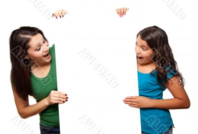 Pretty Hispanic Girl and Mother Holding Blank Board