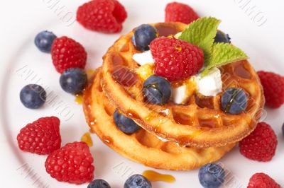 Belgian waffles with berries and cream