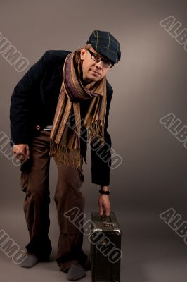 young man with suitcase in glasses