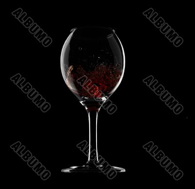 Wine glass with wine splash inside