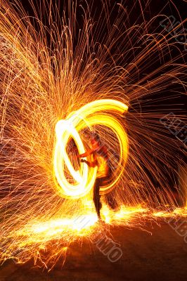 Firedancer surrounded by fire and sparks