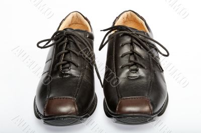 Two brown shoes on with background