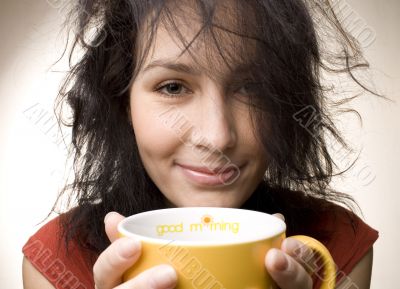 positive girl with yellow cup