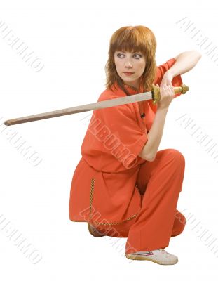 woman makes exercise with sword