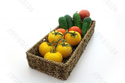 Yellow tomatos, red tomato, cuke, basket