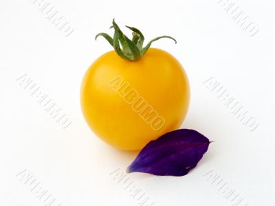 Yellow tomato and leaf