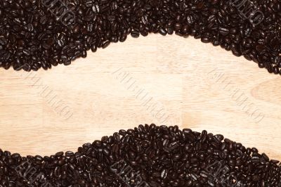 Dark Roasted Coffee Beans on Wood Background