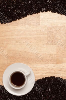 Dark Roasted Coffee Beans on Wood Background