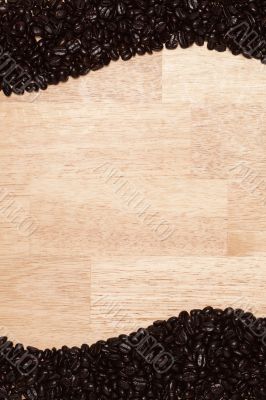 Dark Roasted Coffee Beans on Wood Background