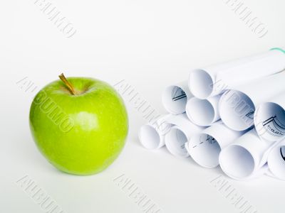 Green apple and sheet of paper