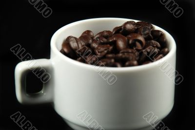 Coffee beans and cup