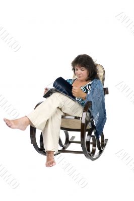 Woman reading magazine on white