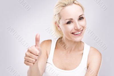 Portrait of  female with thumbs up.