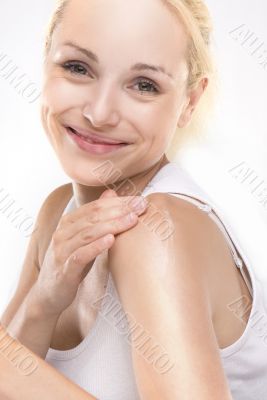 young beautiful girl applying cream