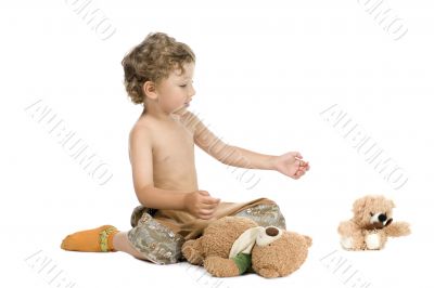 little boy play toy bear