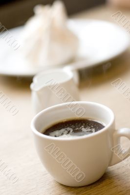 cup of coffee, milk and meringue