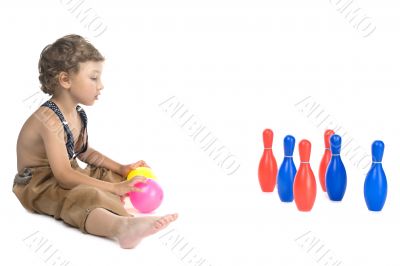 boy play skittles on white