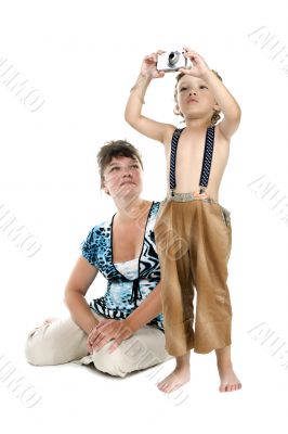expectant mother and son with camera