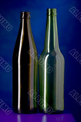 Glass bottle on blue