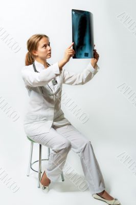 attractive young female blonde doctor with x-ray