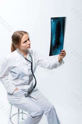 attractive young female blonde doctor with x-ray