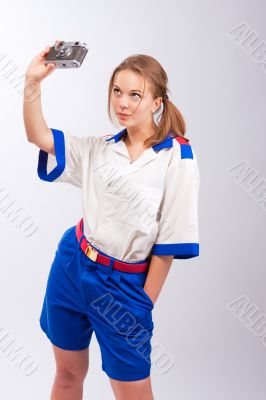 smiling pretty blonde female sailor with camera