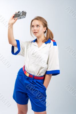 smiling pretty blonde female sailor with camera