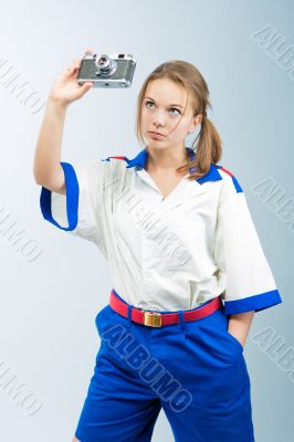 pretty young blonde female sailor with camera