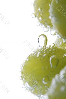 Green grapes in water macro