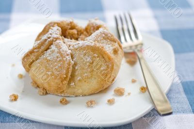 Apple Blossom Pastry on a white plate with a fork