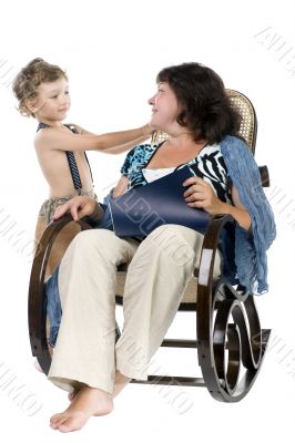 Woman reading magazine and son