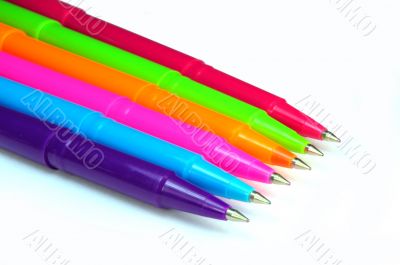 Multicolor pens on white background