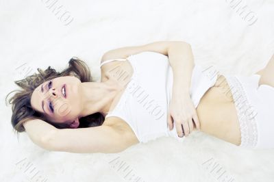 Young woman laying bed