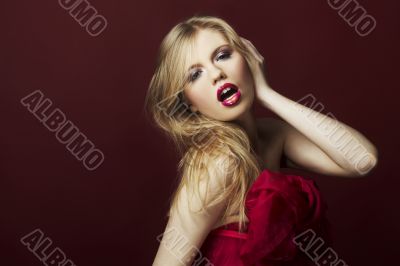 sexy blond girl on red background