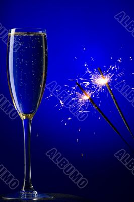 champagne and sparkles on blue