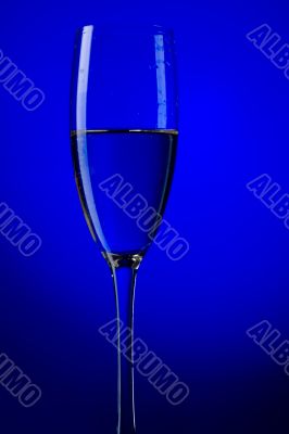 champagne glasses on blue background macro