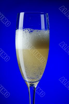 champagne glasses on blue closeup