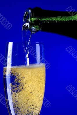 champagne glasses closeup on blue